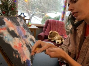 Peter working on watercolor of gaseous nebula and stars