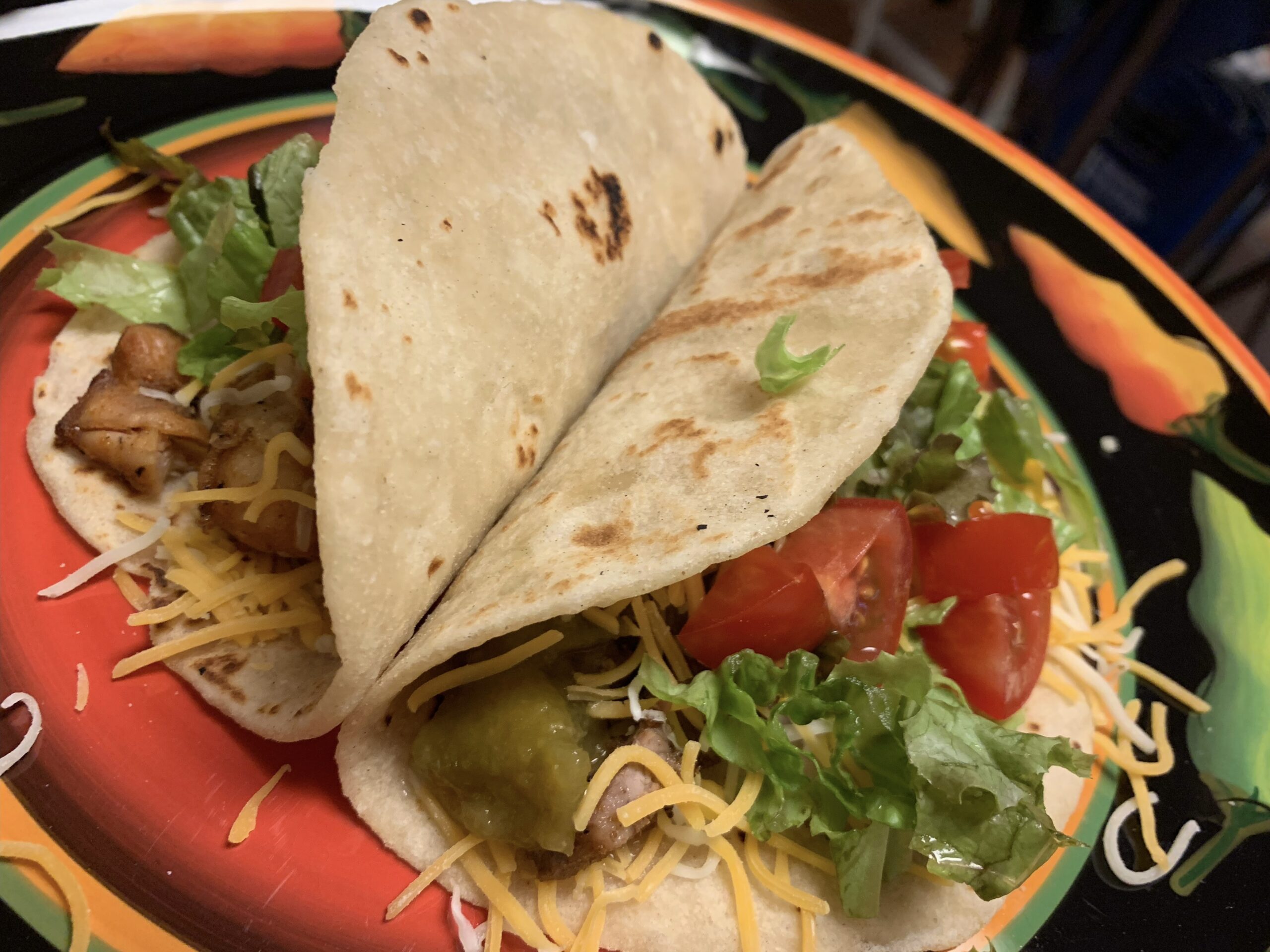 Soft tacos with meats salsa cheese tomatoes lettuce homemade tortillas